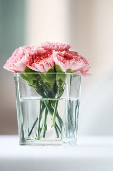 Bouquet of carnation flowers in glass vase