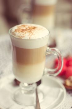 Transparent glass with latte in a cafe
