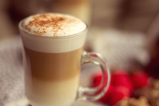 Transparent glass with latte in a cafe