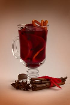 Hot red mulled wine with fruits and cinnamon