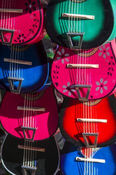 display of colorful toy guitar