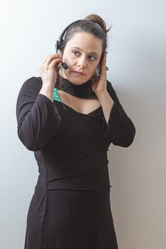 thirty something phone agent with headset concentrating on the conversation