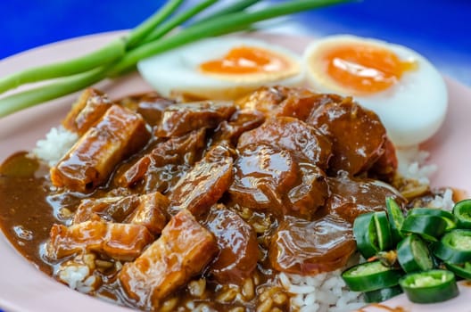 "Khao Moo Daeng"  BBQ Pork over rice . famous Thai Food
