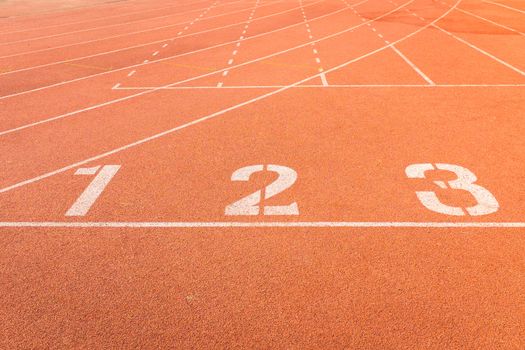 red color and texture of athletics track lanes with white line and number