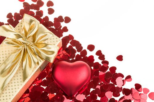 small red hearts confetti and present box isolated on white background