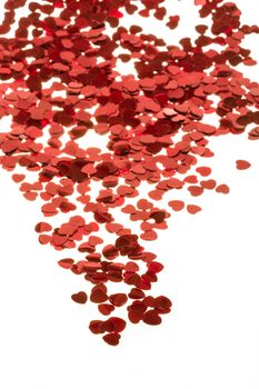 small red hearts confetti isolated on white background
