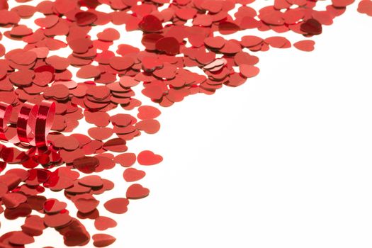 small red hearts confetti isolated on white background