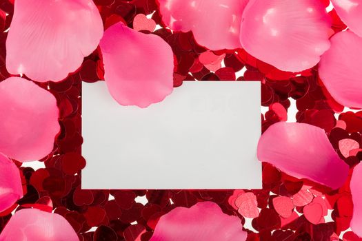 small red confetti and emty card for valentine love message