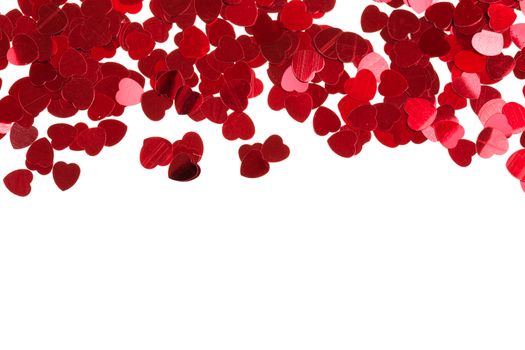 small red hearts confetti isolated on white background