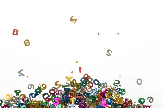 small color numbers confetti isolated on white background