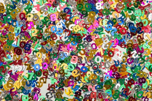 close up of small color numbers confetti background or backdrop