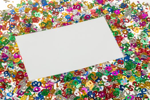 close up of small color numbers confetti and empty card