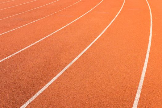 red color and texture of athletics track lanes with white line