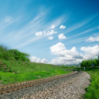 railroad to horizon and cloudy sky