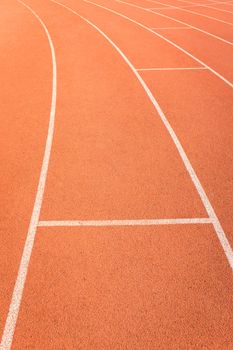 red color and texture of athletics track lanes with white line