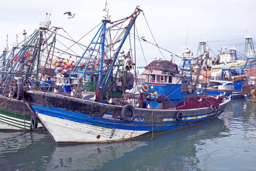 Fishing boats at the harbor from Essaouria. Essaouria is the most popular Atlantic coast city in Morocco.