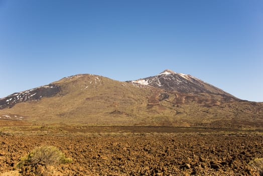 The vulcano Teide surrounded by a lava rock landscape on Tenerife, Canary Islands