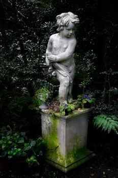 Kid sculpture in garden