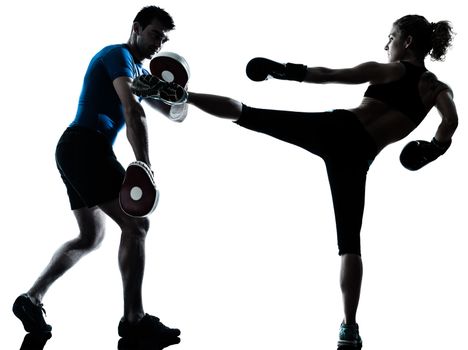 one caucasian couple man woman personal trainer coach man woman boxing training silhouette studio isolated on white background