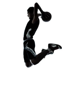 one young man basketball player dunking silhouette in studio isolated on white background