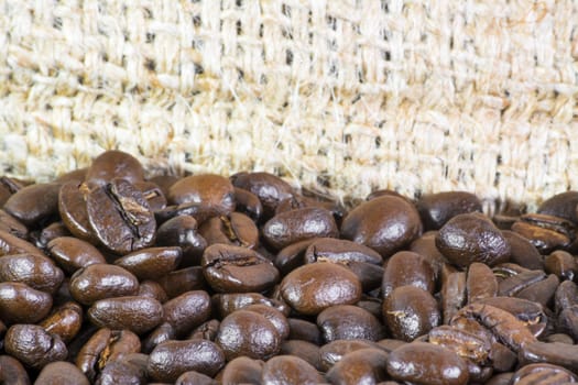 Detail of coffee beans and jute bag background