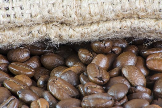 Details of coffee beans and jute bag texture