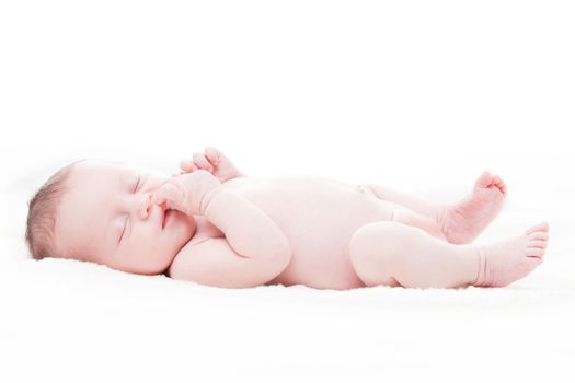 happy newborn baby girl just a week old photographed in the studio