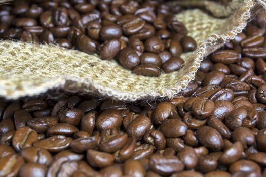 Coffee beans inside his jute bag with side lighting