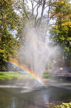 Fountain with rainbow in the park of Czestochowa, Poland