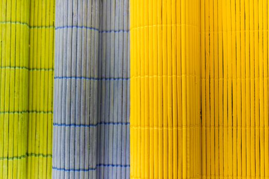 Tablecloths folders three different colors with a textured wooden branches