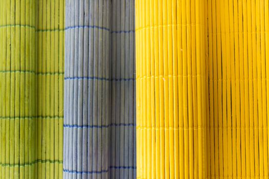 Tablecloths folders three different colors with a textured wooden branches