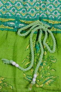 Detail take of a green patterned cotton cloth