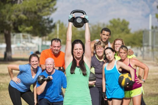 Young woman struggling with weighs in fitness class