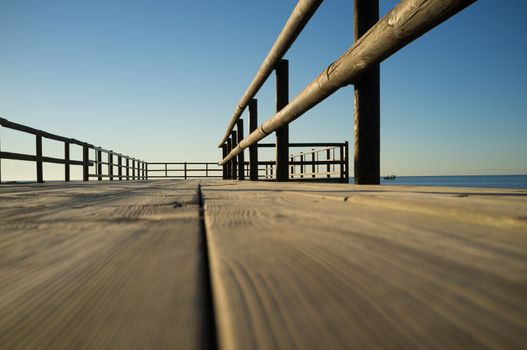 Low angle viepoint of a wooden jetty