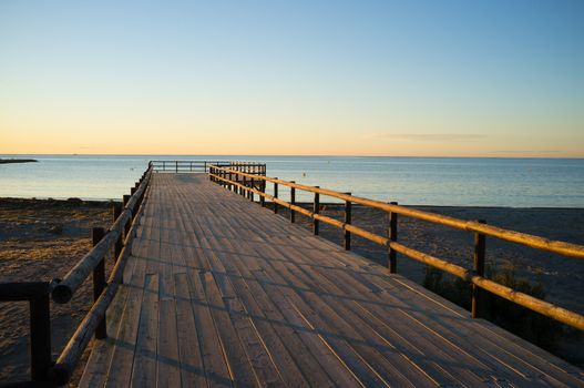 Wooden jettyu  under the golden light of sunris