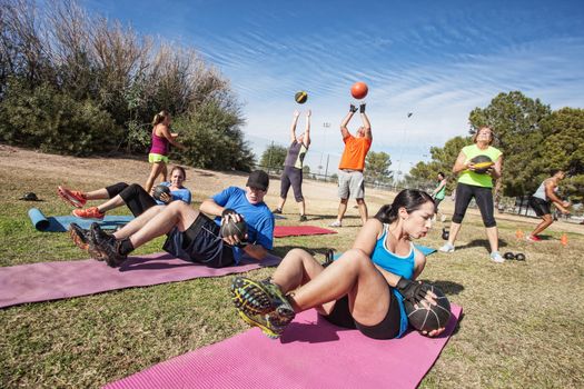 Group of mature adults working out in fitness class