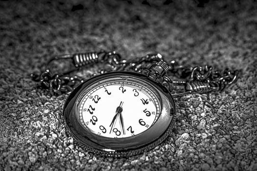 Chain Watch and sand in black and white