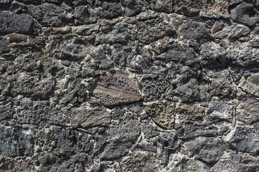 Wall of volcanic rock and cement to detail