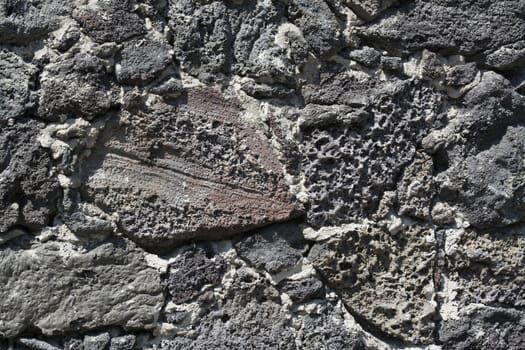 Wall of volcanic rock and cement to detail