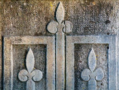 Old Gravestone with Ornate Flower Pattern closeup