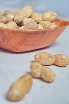 Peanuts in a brown bowl