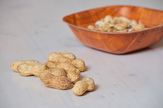 Peanuts in a brown bowl