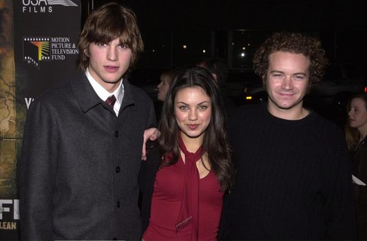 Ashton Kutcher Mila Kunis Danny Masterson at the premiere of USA Films "Traffic" in Beverly Hills, 12-14-00