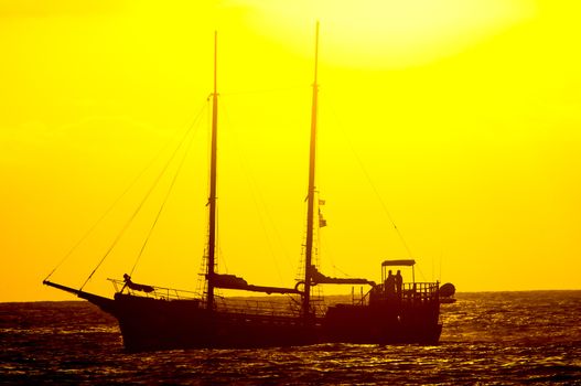 Antique Vintage Sail Vessel on the Ocean at Sunset