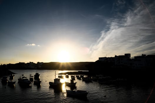 Backlight Silhouette Boats at Sunset in the Atlantic Ocean