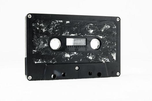 Ancient Vintage Used Musicassette over a White Background