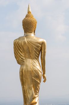 Buddha standing on a mountain Wat Phra That Khao Noi, Nan Province, of Thailand