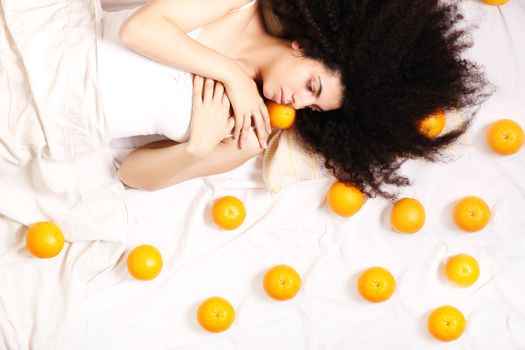 A young south american woman dreaming of fruits.