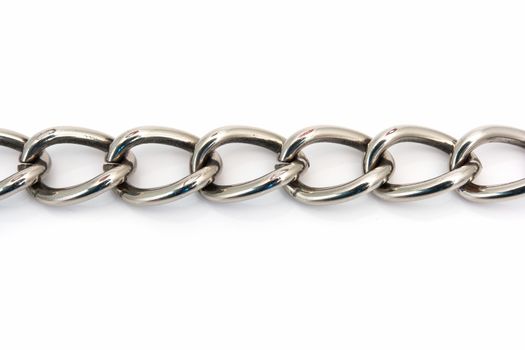 closeup of a metal chain link segment on white background
