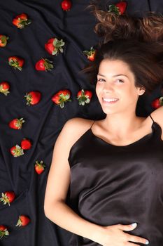 A young adult american woman dreaming of strawberries.